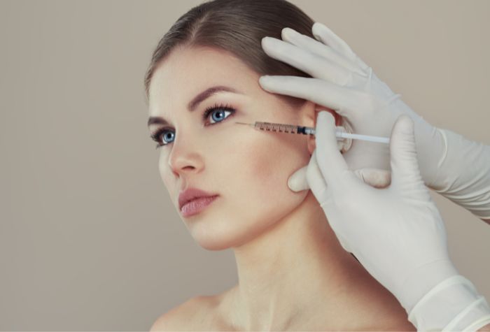 A woman having a Botox treatment, a service offered at Evexia Medspa in Tysons Corner, VA.