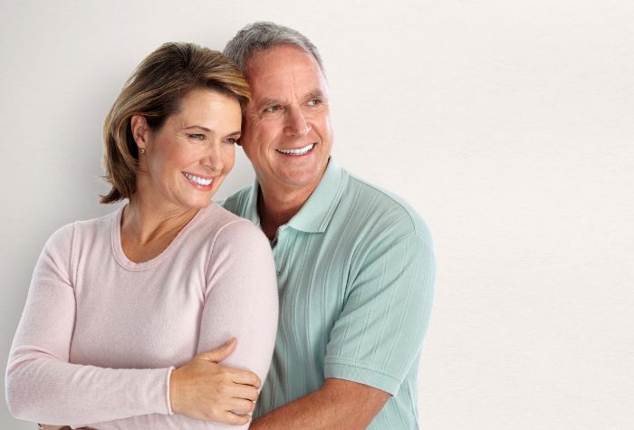 A happy couple satisfied of their life from hormone replacement therapy, a service offered at Evexia Medspa in Tysons Corner, VA.