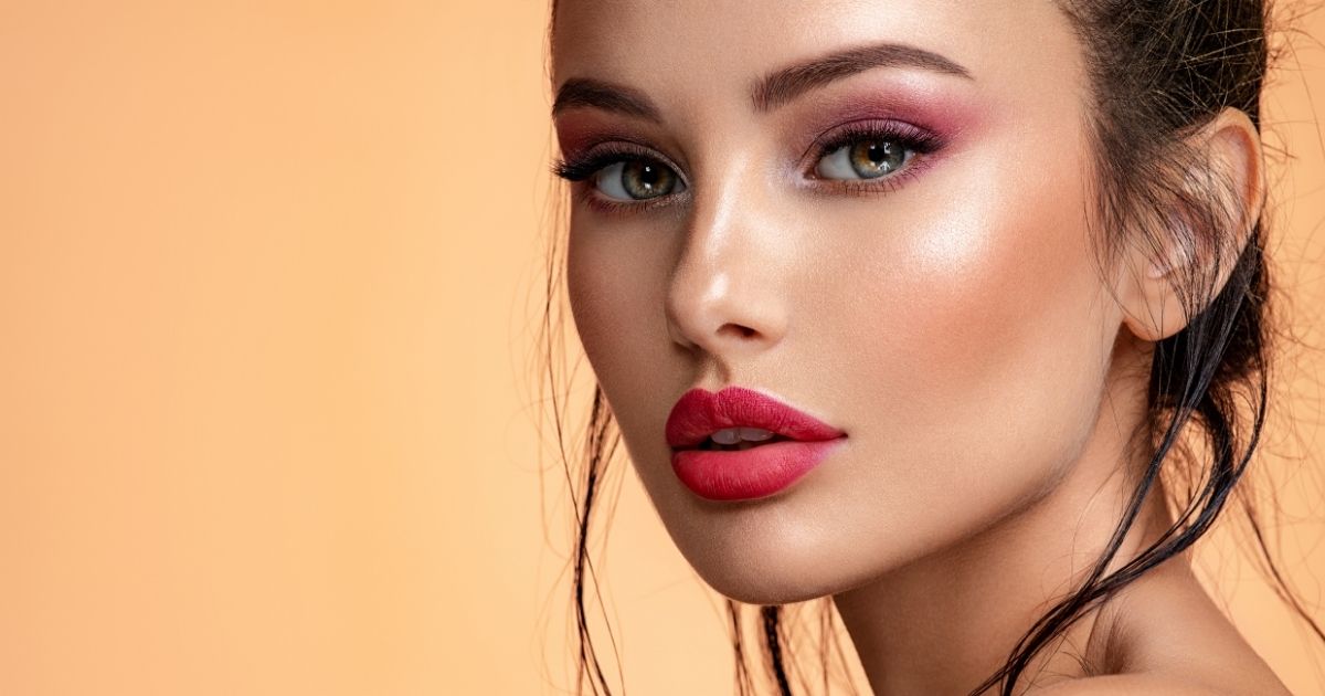 Close-up portrait of a woman with smooth skin and naturally enhanced lips.