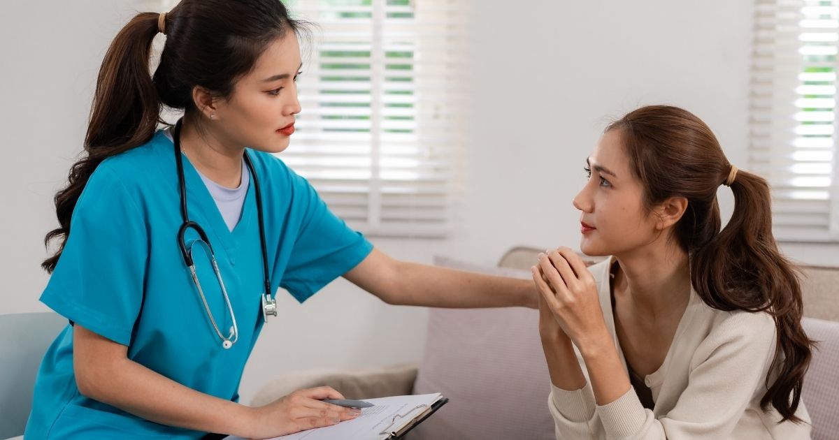 Med spa provider consulting with a patient during an initial treatment appointment.