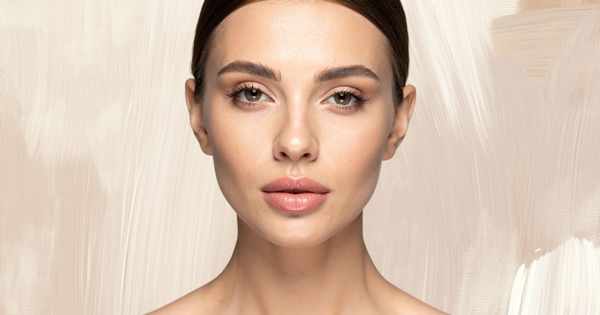 Woman with smooth, glowing skin looking at the camera.